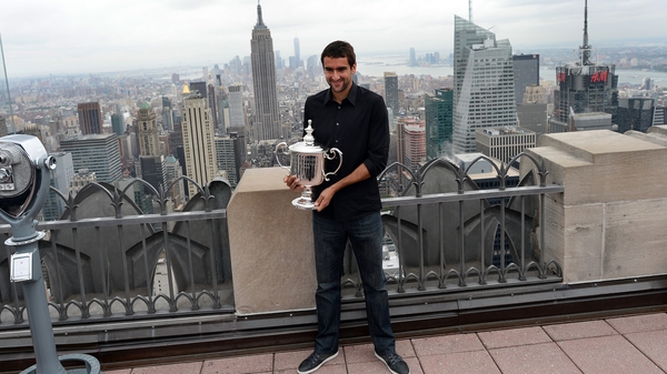 Marin Cilic poses with his prize in New York