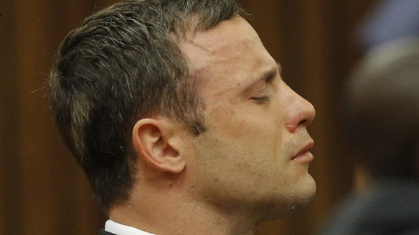Oscar Pistorius sits in the Pretoria High Court