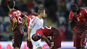 Portugal players react after their loss to Albania