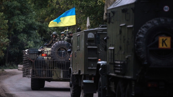 A military vehicles drive on a road in Kramatorsk town, near Slaviansk, Ukraine