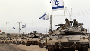 Israeli Merkava tanks drive near the border between Israel and Gaza