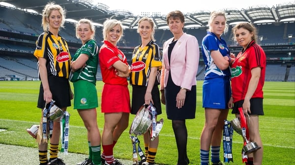 The six final captains with Camogie Association President Aileen Lawlor