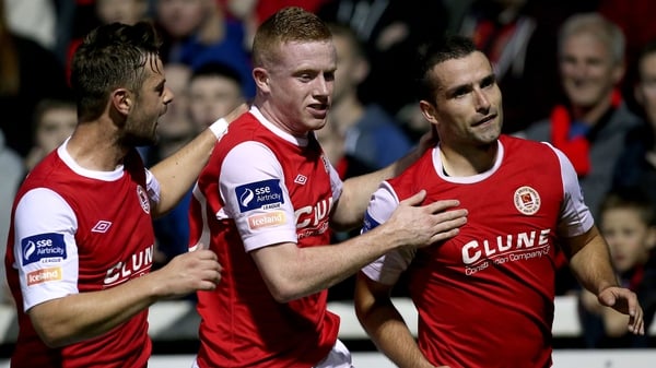 Christy Fagan celebrates with Greg Bolger and Sean Hoare after scoring the Saints' first goal