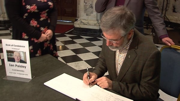 Sinn Féin President Gerry Adams signs the book of condolence for Ian Paisley in Berlfast