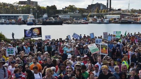 Enviromental protesters gather in a park in Sydney as part of a global protest on climate change