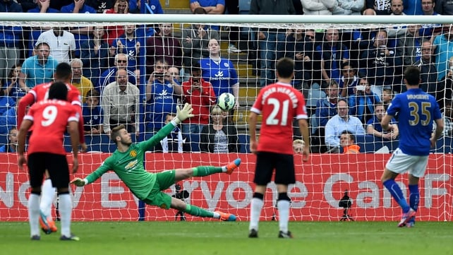 Leicester fans look on as David Nugent of Leicester City scores his teams second goal from the penalty spot past the diving David De Gea of Manchester United
