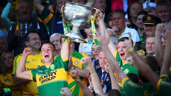 Kerry's Fionn Fitzgerald and Kieran O'Leary lift the Sam Maguire cup