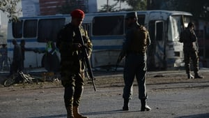 Afghan security personnel at the site of the bomb attack on the army bus in Kabul