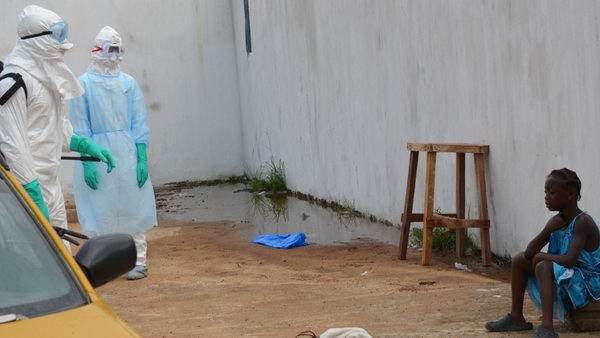 A child cries outside a clinic in the Sierra Leone capital after the deaths of her parents from Ebola