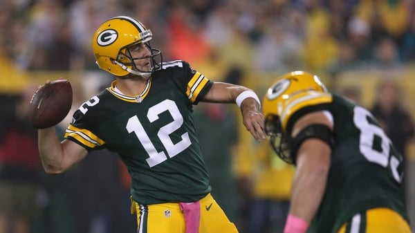 Aaron Rodgers of the Green Bay Packers looks to pass against the Minnesota Vikings