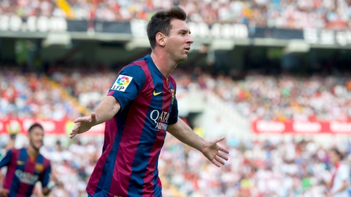 Lionel Messi celebrates after putting Barcelona in front against Rayo Vallecano