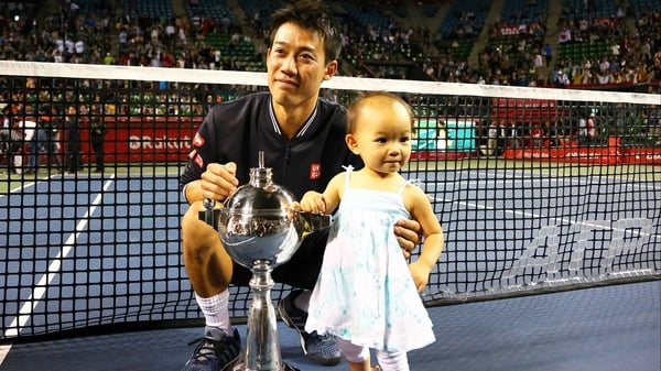 Kei Nishikori shares his triumph with the daughter of his coach Michael Chang