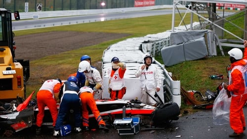Jules Bianchi receives urgent medical treatment after crashing