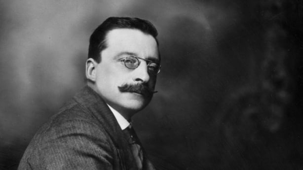 Arthur Griffith looks at the camera