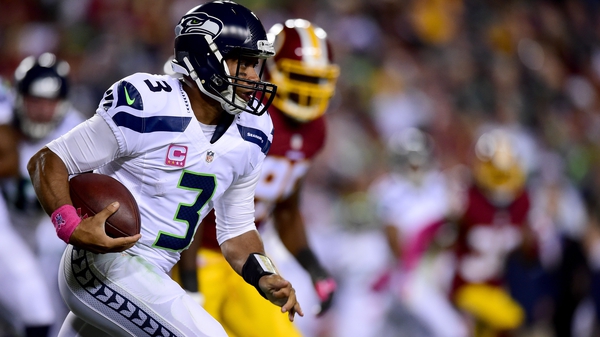 Quarterback Russell Wilson of the Seattle Seahawks rushes during the first half of the win over Washington Redskins