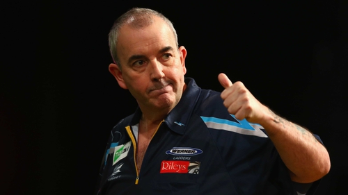 Phil Taylor cruised into the next round of the World Grand Prix