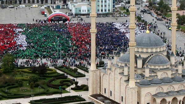 Some of the 100,000 marchers celebrating Vladimir Putin's 62nd birthday in Chechen capital Grozny