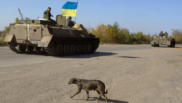 A Ukrainian armored personnel carrier patrols along a road leading to the town of Debaltseve in the Donetsk region