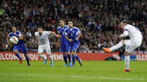 Wayne Rooney scores from a penalty to give England their second goal