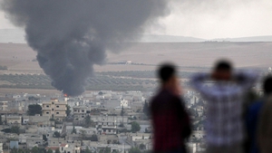 Kurdish defenders in Kobane are trying to halt an advance by IS fighters