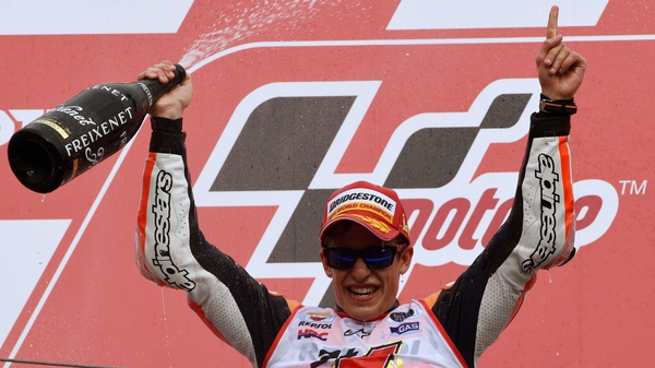 Marc Marquez celebrates his victory in traditional motorsport style - shades and champagne obligatory