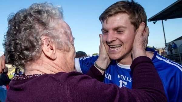Cratloe's Padraic Collins celebrates with his grandmother Annette Collins after the game