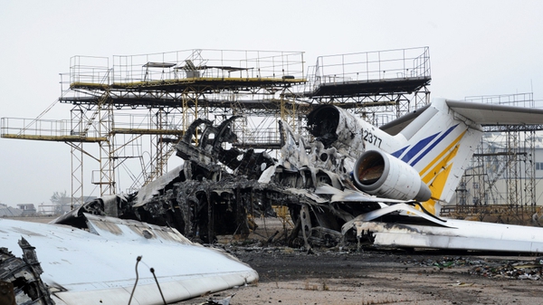 The carcasses of a destroyed aeroplane is seen on the tarmac at Donetsk's Sergey Prokofiev international airport