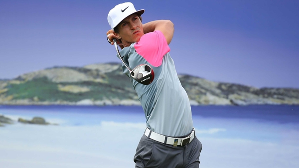 A less than usual graphic accompanies Thorbjorn Olesen as he tees off at the 15th