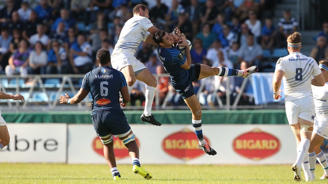 Leinster’s Zane Kirchner challenges Castres’ Geoffrey Palis in the air