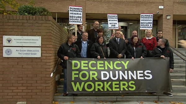 Dunnes Stores employees are seen at an October protest