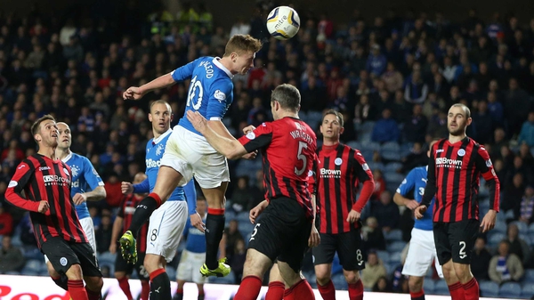 There can be only one winner of this ball as MacLeod scores for Rangers during the Scottish League Cup quarter-final against St Johnstone