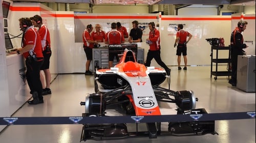 Marussia technicians and the team car