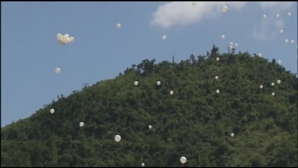 Balloons were released to commemorate the dead