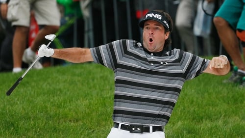 Bubba Watson celebrates holing his bunker shot for a remarkable eagle on  18