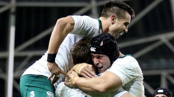 Conor Murray and Richardt Strauss congratulate Tommy Bowe on his try