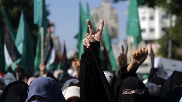 Palestinian female supporters of Hamas gesture during a rally in Gaza