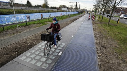 A cyclist on the SolaRoad, the first road in the world made of solar panels