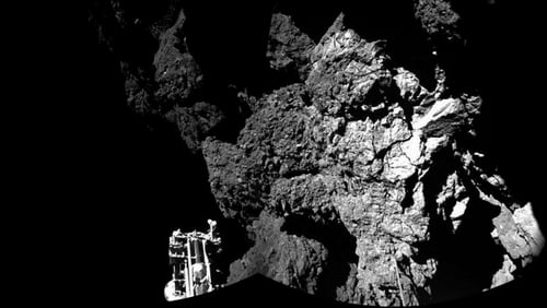 Philae is resting precariously on two out of three legs in the shadow of a cliff on the comet