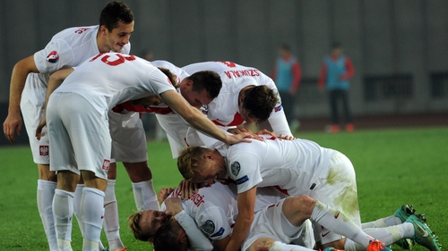 Poland's players celebrate after scoring against Georgia