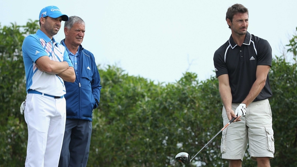 (L to R) Sergio Garcia and his father watch as Juan Carlos Ferrero tees off at the 2013 pro-am for the Open de Espana