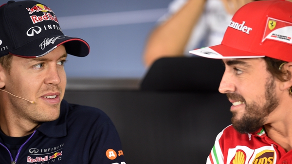 Sebastian Vettel (l) takes over from Fernando Alonso