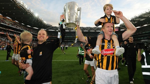 Tommy Walsh with his son Finn and Henry Shefflin with his son Henry celebrate after the final whistle in the 2014 All-Ireland hurling final replay