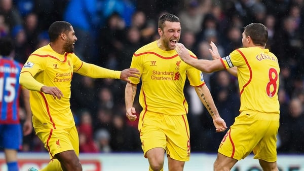 Liverpool's Rickie Lambert (C) celebrates scoring the opening goal with team-mates Glen Johnson and Steven Gerrard
