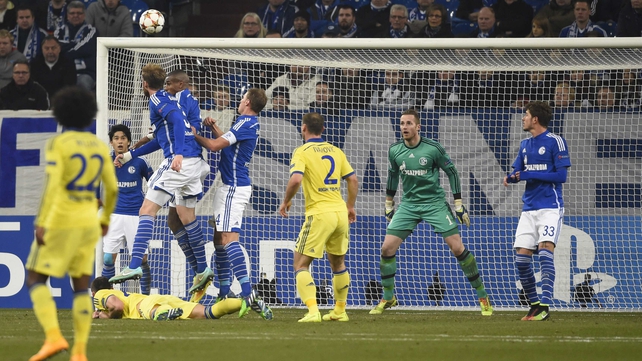 Schalke's defender Jan Kirchhoff (third left) heads into the back of his own net