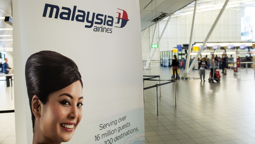 An advertising banner for Malaysia Airlines at Schiphol Airport, near Amsterdam