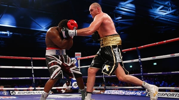 Tyson Fury lands a left hook on Dereck Chisora