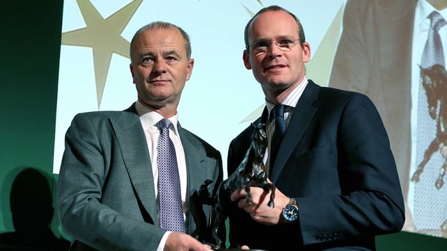 Trainer Edward Lynam receiving the Flat Award from Minister Simon Coveney