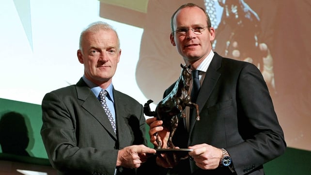 Trainer Willie Mullins receiving the National Hunt award from Minister Simon Coveney TD  