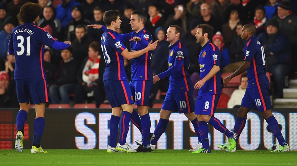 Robin van Persie is congratulated after scoring the first of his two goals against Southampton