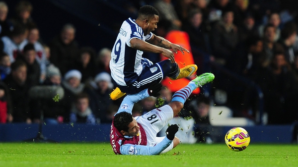 Aston Villa's Kieran Richardson was shown a straight red card for this tackle on Stephane Sessegnon